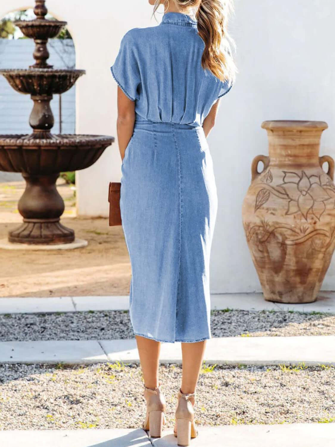 Elegant Button-Up Short Sleeve Dress in light denim, showcasing a stylish and relaxed fit, perfect for women's fashion.