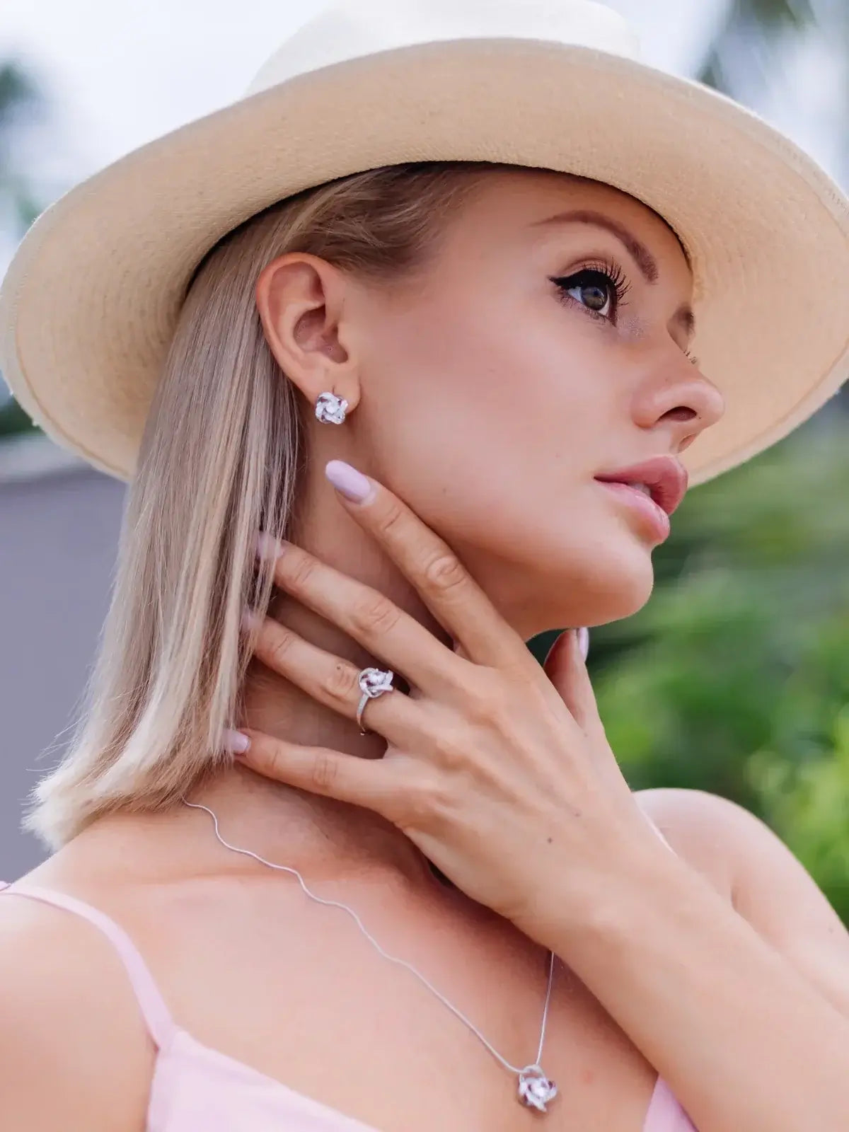 Stylish earrings for everyday wear showcased with a hat and elegant jewelry, enhancing casual elegance and comfort.