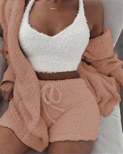 Model wearing a white fuzzy cami with peach drawstring shorts and a matching cardigan
