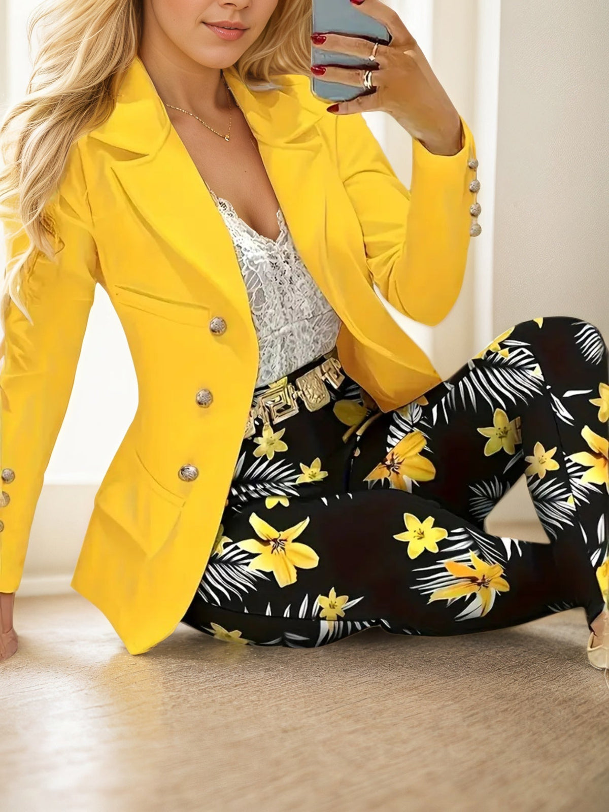 Woman wearing womens printed pants suit with yellow blazer and floral printed pants, exuding confidence and style.