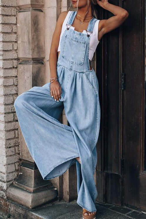 Women’s wide-leg denim overalls styled with a relaxed fit, perfect for casual outdoor activities.