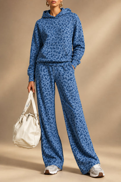 Model wearing a blue leopard print hoodie and wide-leg pants set