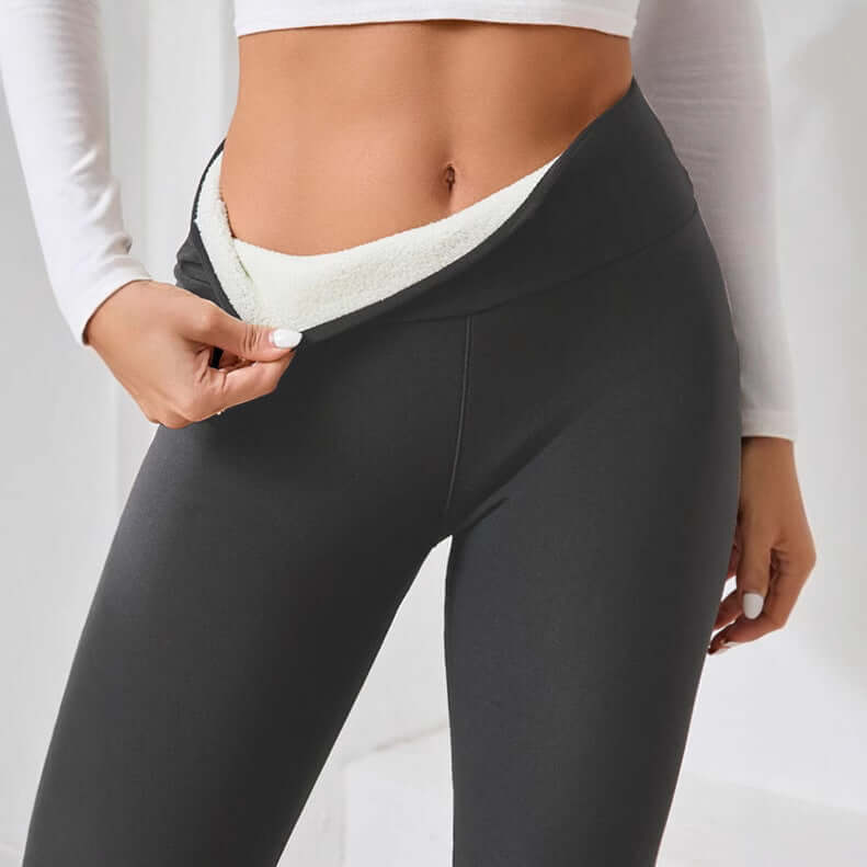 Model showcasing fleece lined cashmere winter leggings with soft interior fabric.