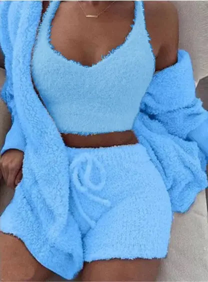 Close-up of the light blue fuzzy cami top, shorts, and open cardigan on a model