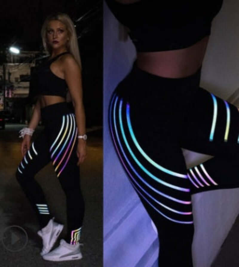 Model wearing printed workout leggings for women with colorful stripes, showcasing a slim fit style and stylish design.