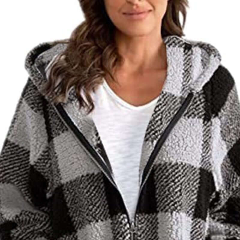 Plaid oversized winter jacket featuring a cozy hood, full zipper, and bold plaid pattern for stylish winter wear.