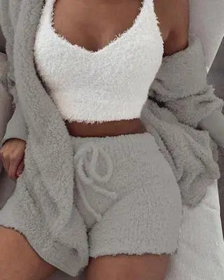 Model wearing a gray fuzzy cardigan with a white cami top and gray drawstring shorts