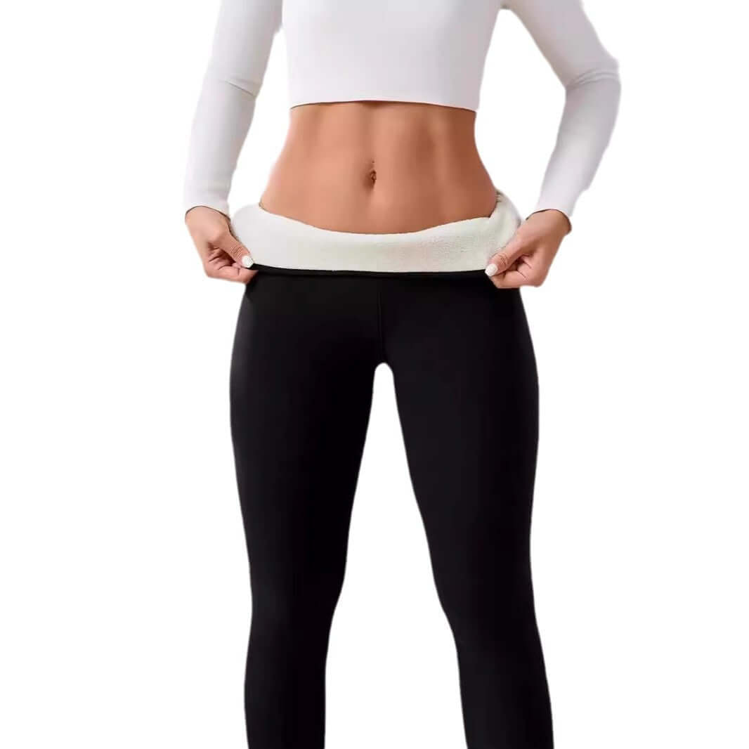 Woman demonstrating fleece lined cashmere winter leggings, highlighting soft fleece interior for warmth and comfort.