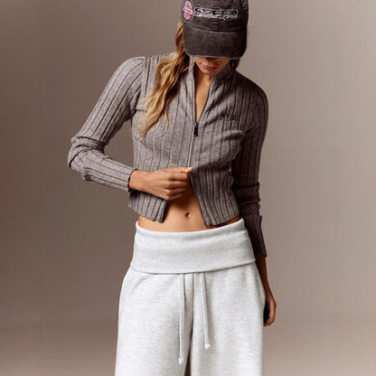 Close-up of the folded waistband and drawstring on the gray wide-leg pants