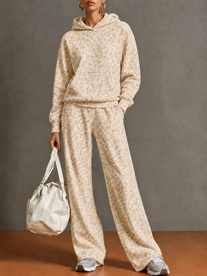 Full-length view of the champagne leopard print hoodie and wide-leg pants set on a model