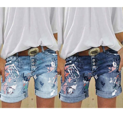 Stylish Women's high-waist printed denim shorts with button closure, featuring a trendy print and comfortable fit.