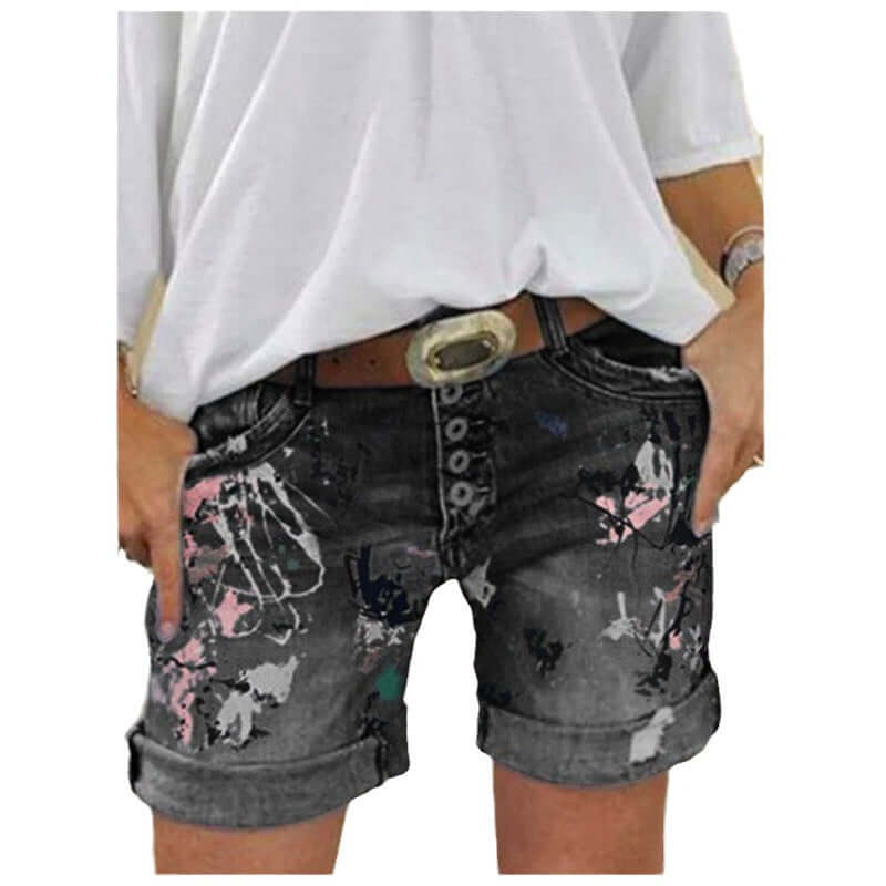 Model wearing women's high-waist printed denim shorts with button closure, featuring a stylish design and five-pocket styling.