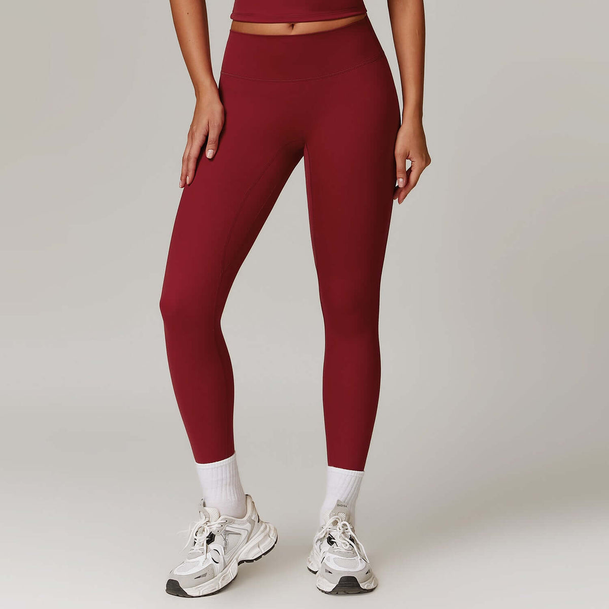 High-waist hip-lifting yoga pants in burgundy, ideal for yoga, dance, and workouts, offering comfort and style.