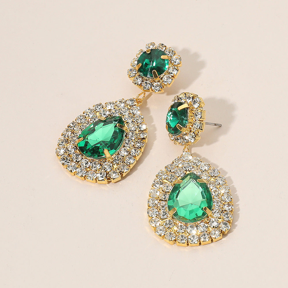 Elegant glass crystal teardrop earrings featuring green gemstones and sparkling embellishments.