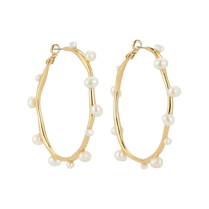 gold tone pearl hoop earrings featuring a sculptural design with asymmetrical freshwater pearls.