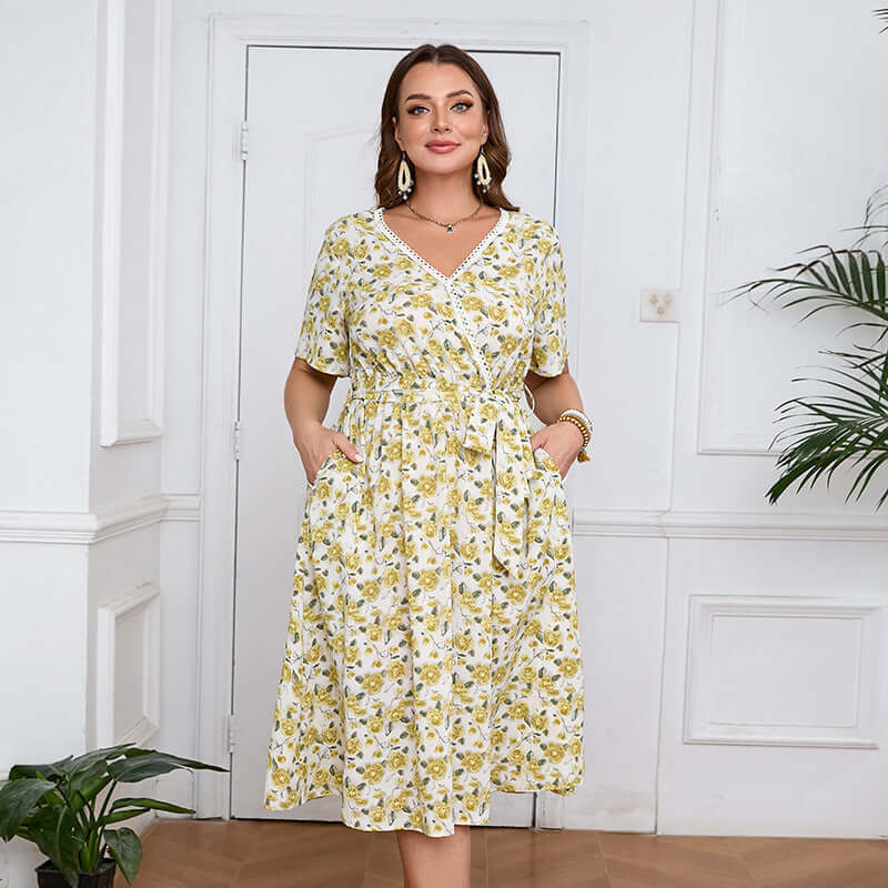 Plus-Size V-Neck Floral Midi Dress in yellow with short sleeves, A-line fit, and practical pockets, perfect for womens fashion.