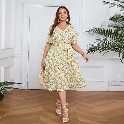 Plus-Size V-Neck Floral Midi Dress in yellow floral pattern, perfect for womens fashion in summer. Flattering A-line silhouette with pockets.