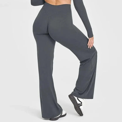 Back view of a woman wearing high-waisted yoga running pants in gray, showcasing comfort and style.