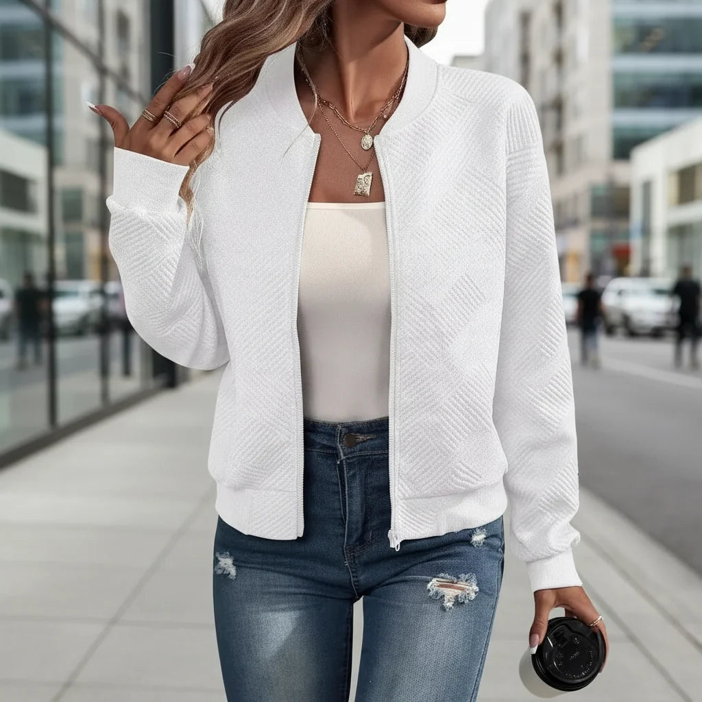 Model wearing a white zip-up stand-collar jacket