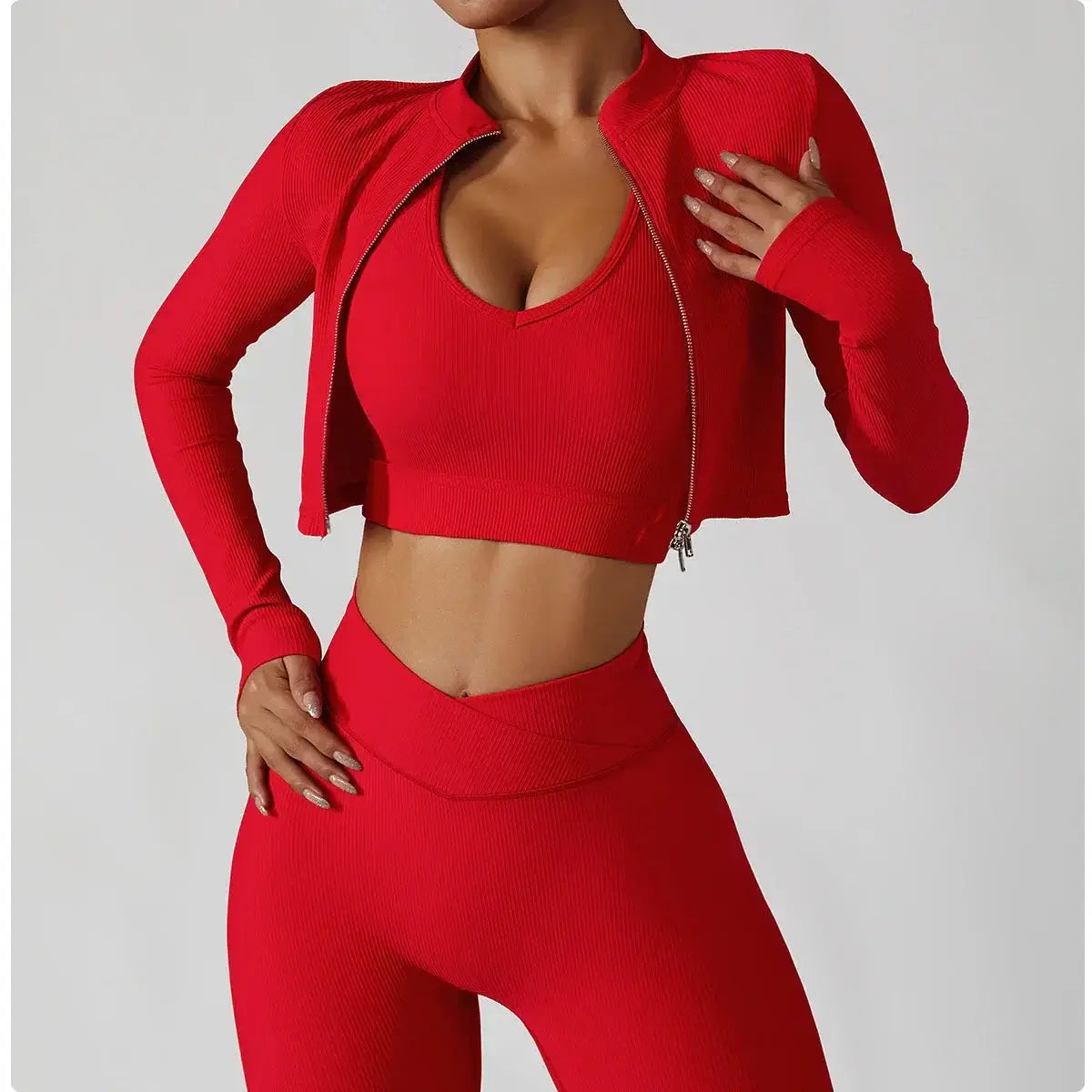 Model showcasing the 3-Piece Seamless Yoga Set – Jacket, Bra & Leggings in vibrant red color.