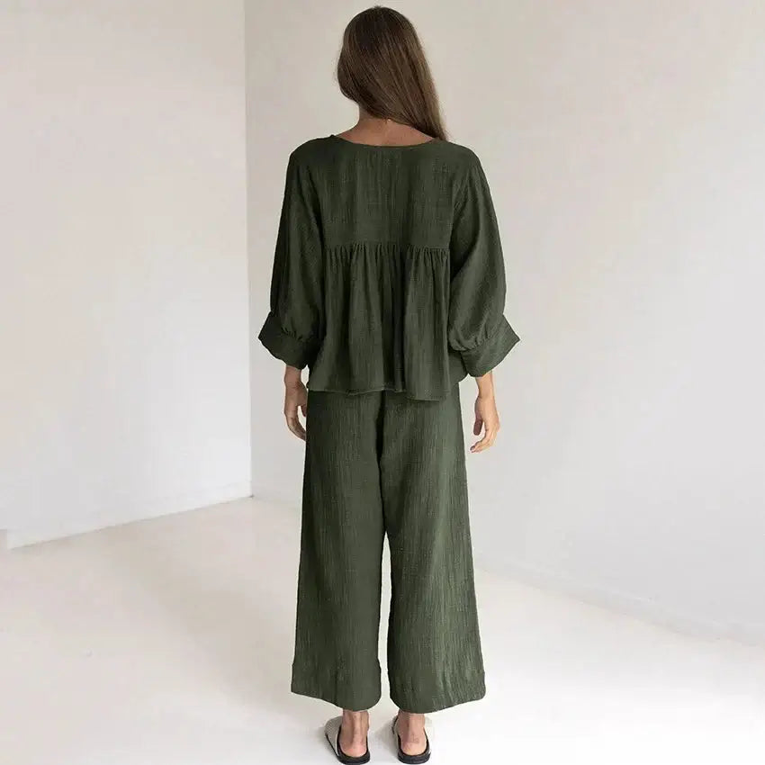 Women's cotton v-neck pajama set in olive green, featuring a relaxed fit and comfortable style for lounging.