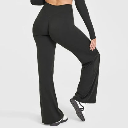 Back view of women's high-waisted yoga running pants in black, showcasing their modern silhouette and comfort features.