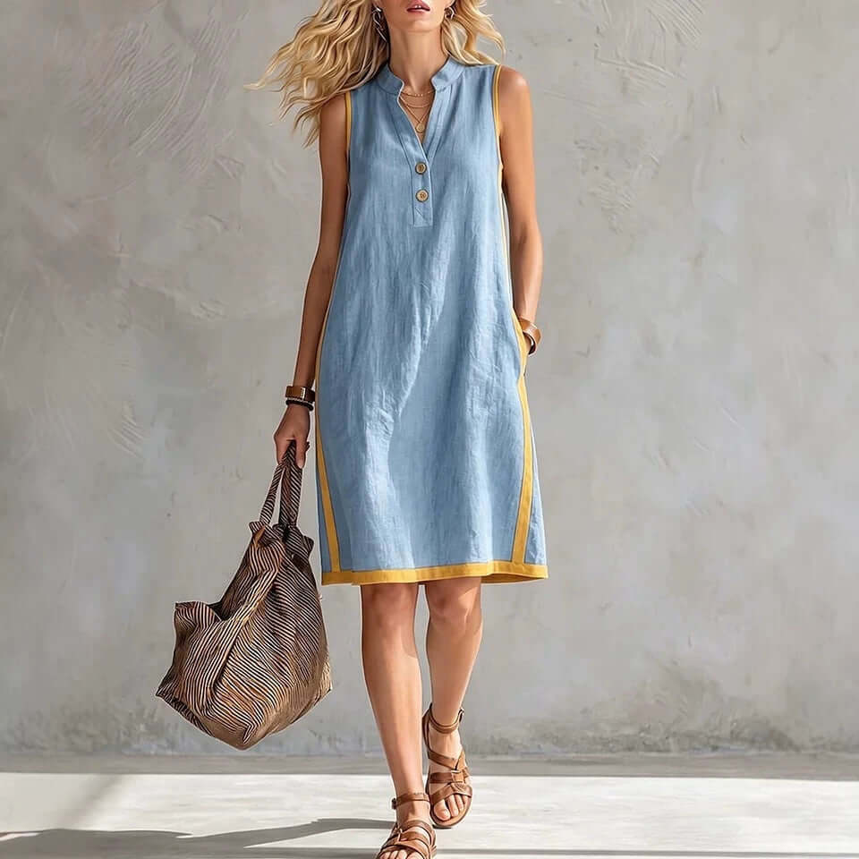 Woman wearing a womens v-neck button-front midi dress with a stylish design and casual look.