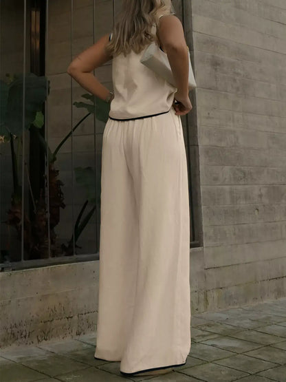 Woman wearing Contrast Trim Top and Wide Leg Pants Set, showcasing the stylish back view and relaxed fit.
