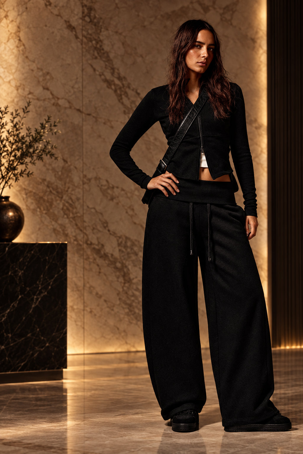 Model wearing black high-waist wide-leg casual pants, front view