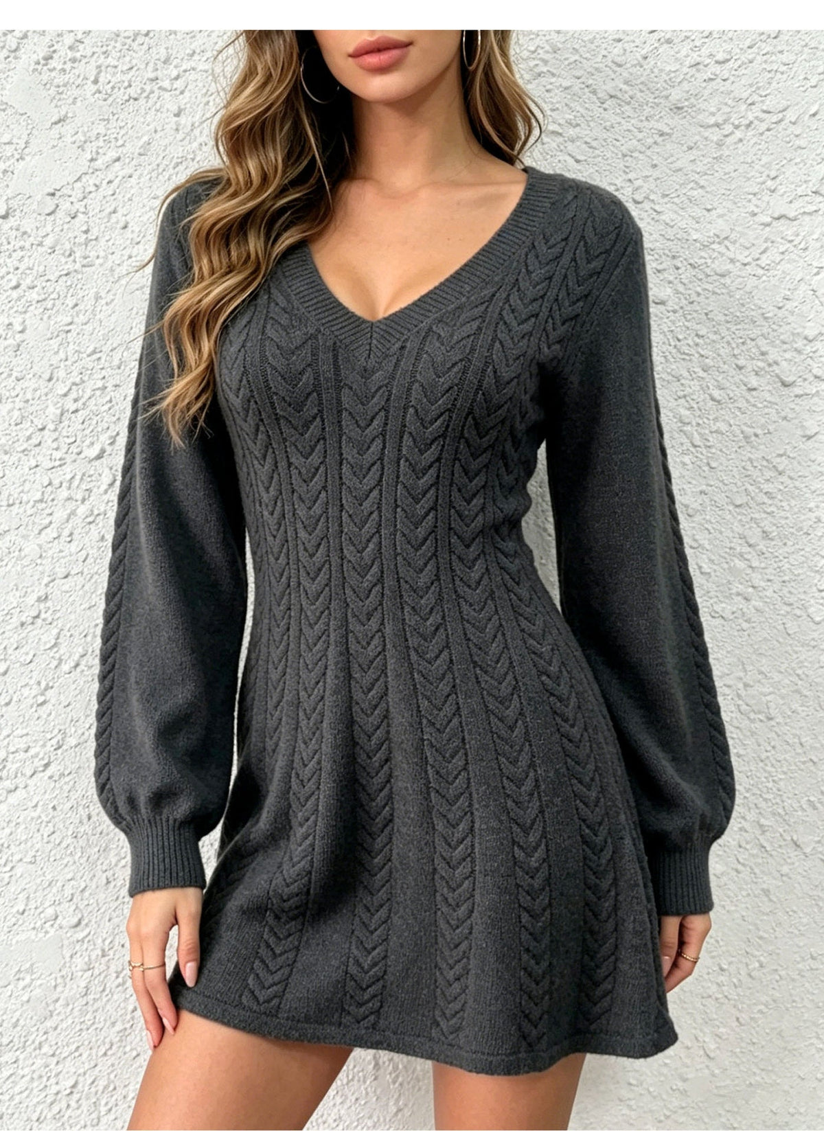 Model wearing a dark gray cable-knit V-neck pullover dress