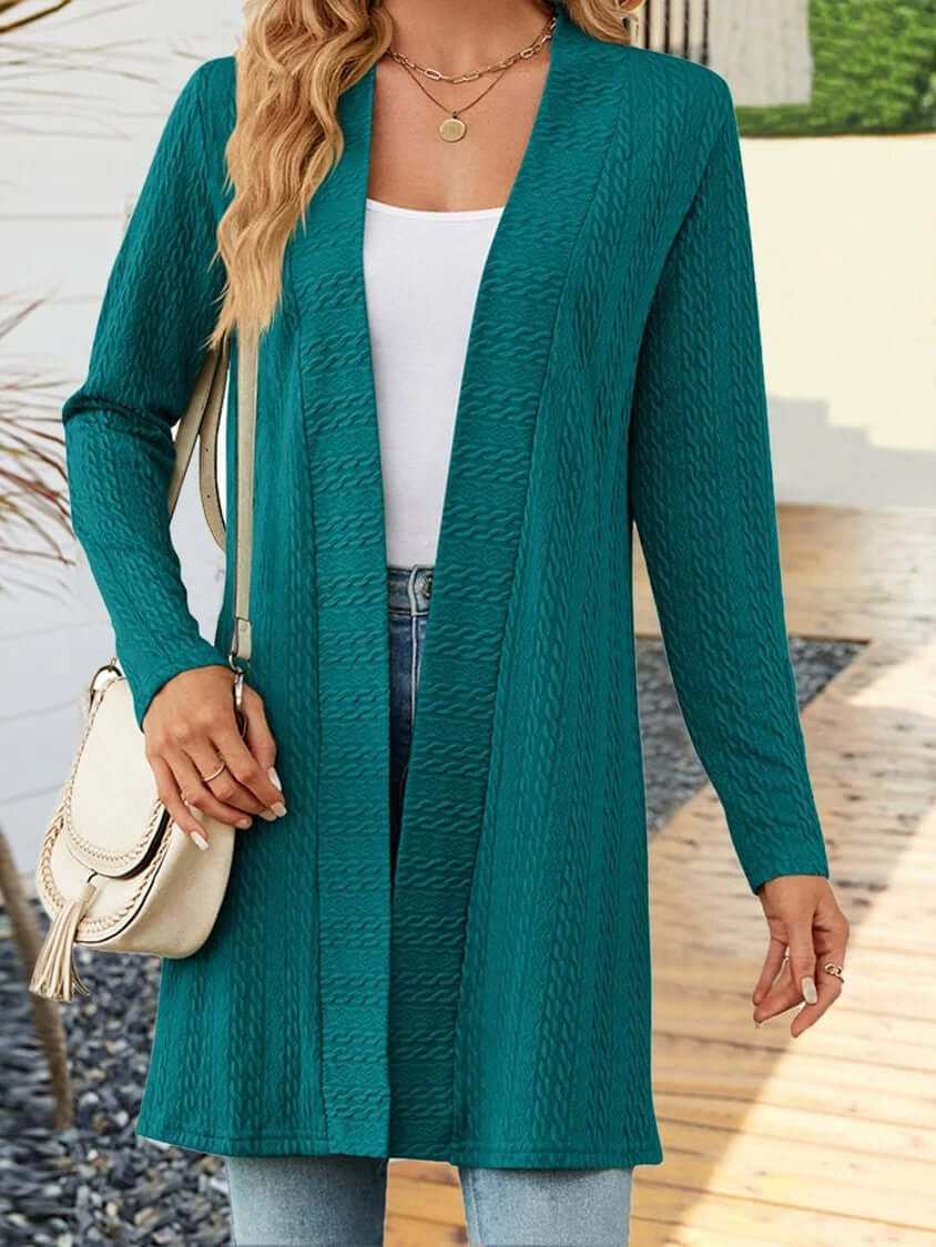Women's knit cardigan in teal, featuring a relaxed fit and open front design, perfect for layering.