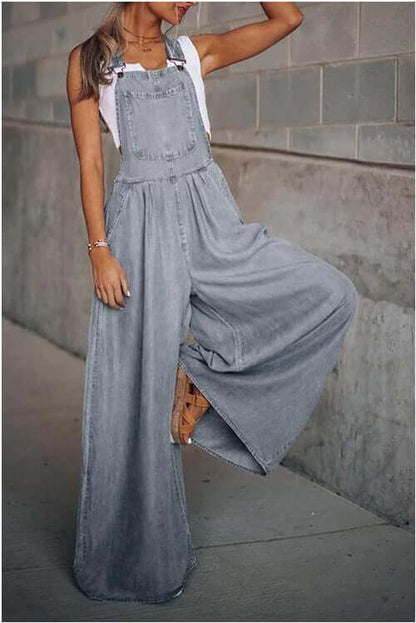 Stylish woman wearing women's wide-leg denim overalls in gray, showcasing modern street fashion.