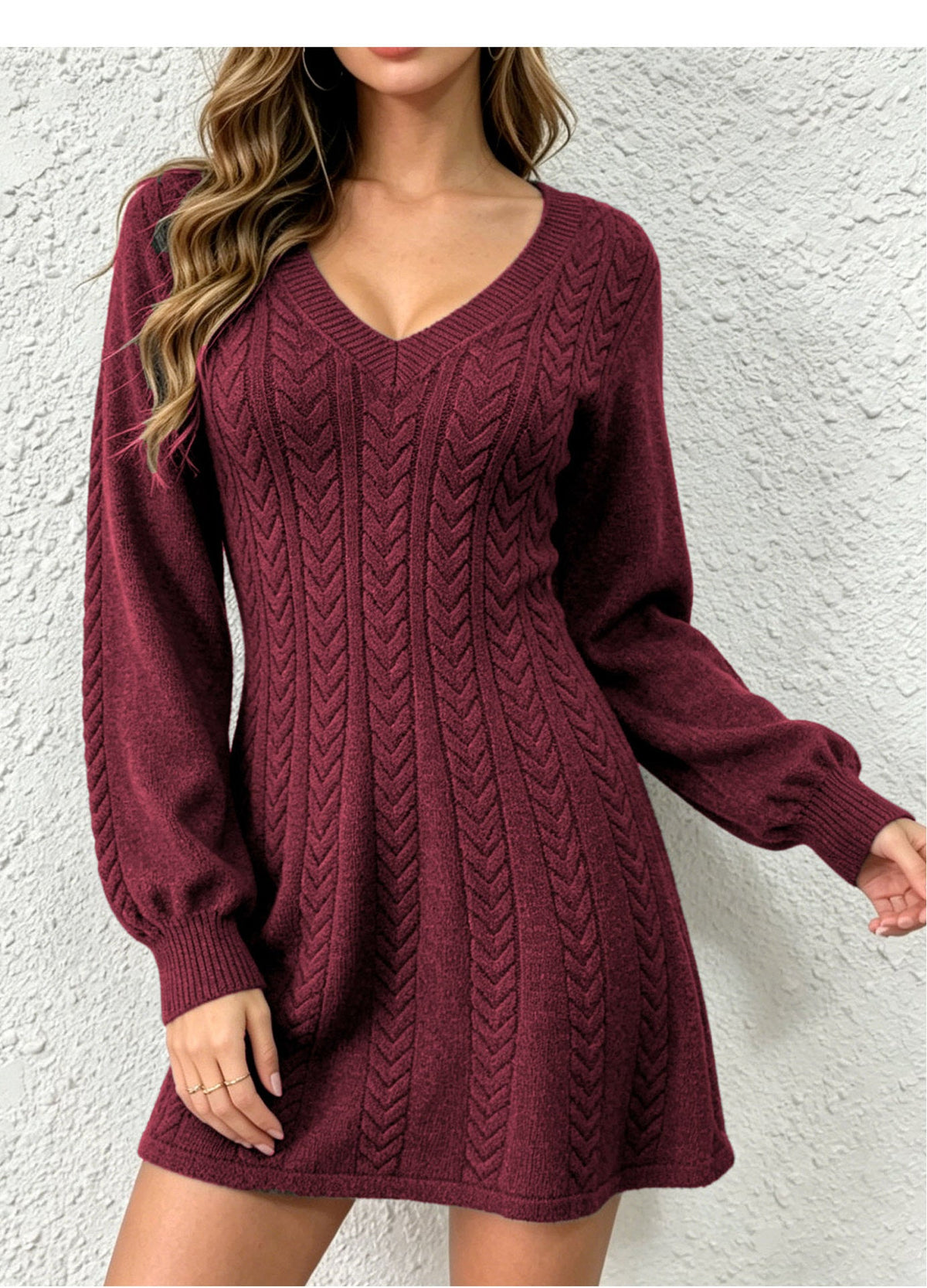 Model wearing a wine red cable-knit V-neck pullover dress