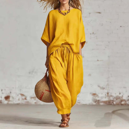 Women's casual t-shirt and ankle pants set in vibrant yellow, featuring a relaxed fit and stylish accessory.