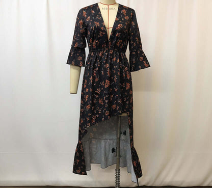 Women's floral denim patchwork midi dress featuring a plunging neckline and flared sleeves.
