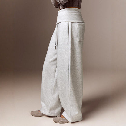 Side view of the gray high-waist wide-leg casual pants on a model