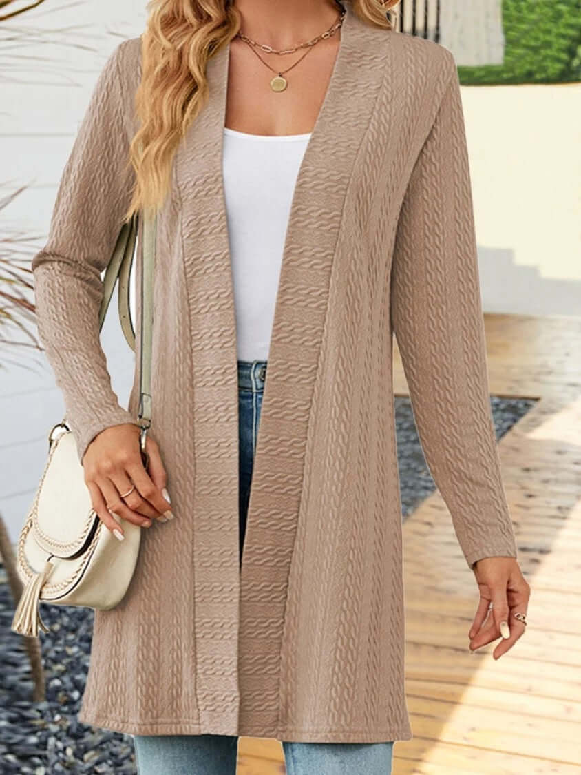 Women’s knit cardigan in beige, featuring a button-down design and relaxed silhouette, ideal for layering.