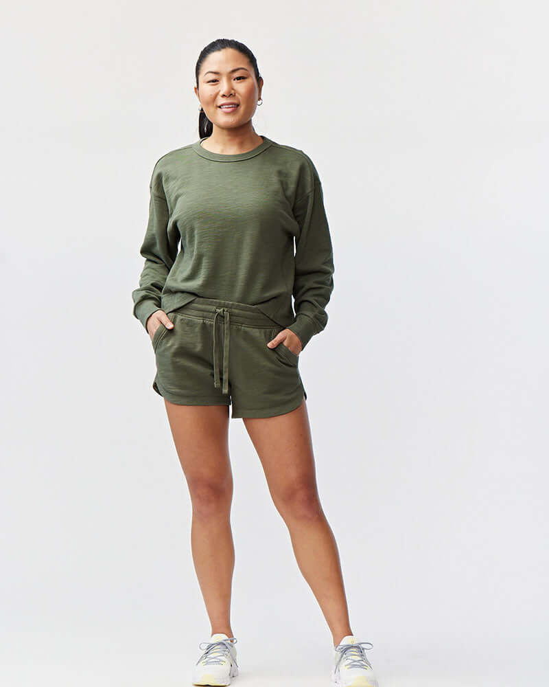 Model wearing Freasy Garment-Washed Cotton Shorts in green, showcasing comfort and style for casual wear.