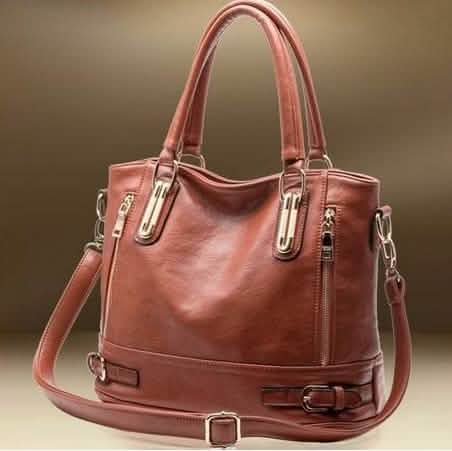 Stylish women's genuine leather shoulder bag featuring a rounded silhouette and dual straps.